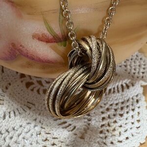 N158 - Textured Gold Tone and Silver Rolling Knot Necklace